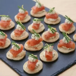 Blinis with creme Fraiche and Smoked Salmon and lemon zest